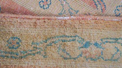 Corner detail of New Isfahan rug showing border pattern and Wool pile