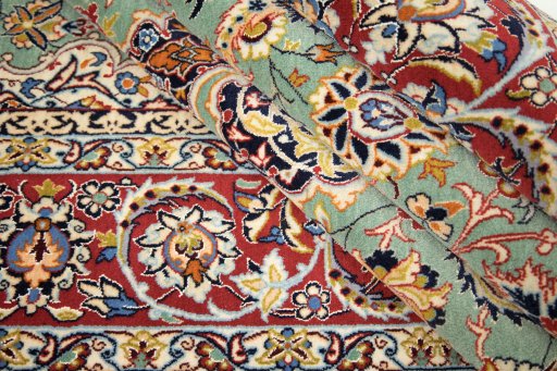 Corner detail of 1990s Isfahan rug showing border pattern and Wool pile