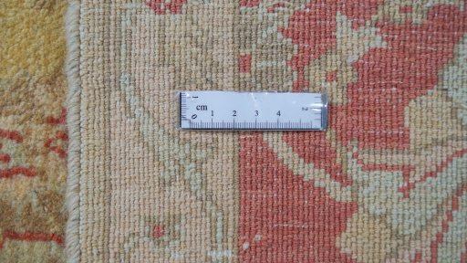 Corner detail of New Isfahan rug showing border pattern and Wool pile