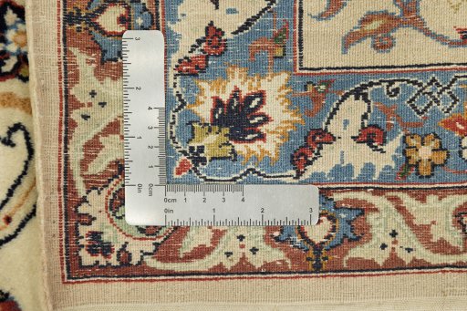 Corner detail of 1970s Isfahan rug showing border pattern and Silk pile