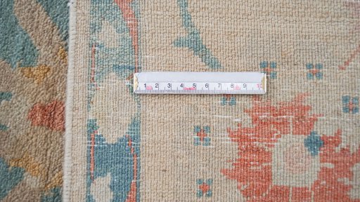 Corner detail of New Isfahan rug showing border pattern and Wool pile