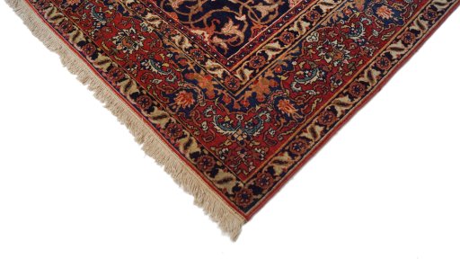 Backside of handmade 1920s Isfahan rug showing knot structure and weave density