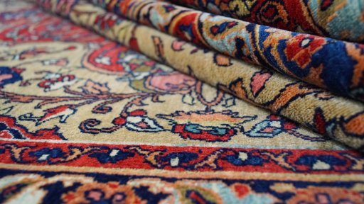 Close-up detail of 1920s Isfahan rug from Iran / Persia showing Wool weave