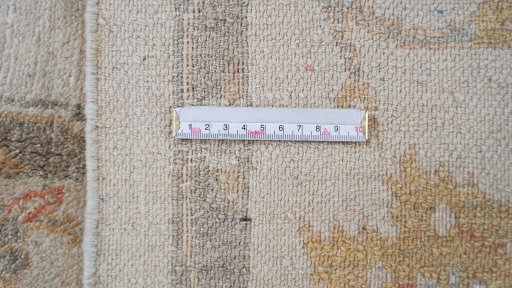 Corner detail of New Isfahan rug showing border pattern and Wool pile