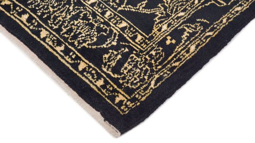 Backside of handmade New Isfahan rug showing knot structure and weave density