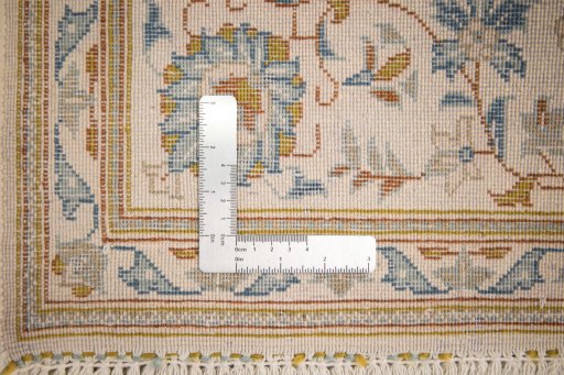 Full view of 1950s Kashan rug from Iran / Persia, 229 × 142 cm in Cream tones