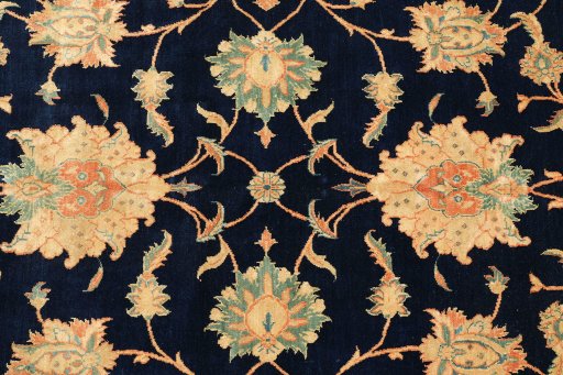Close-up detail of 1990s Isfahan rug from Iran / Persia showing Wool weave