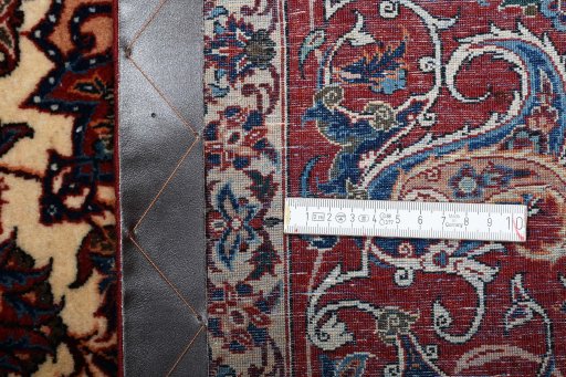 Surface texture of 1930s Isfahan rug with natural Wool and intricate pattern