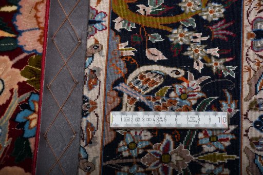 Backside of handmade New Isfahan rug showing knot structure and weave density