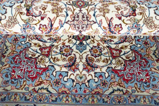 Surface texture of 2000s Isfahan rug with natural Cork and intricate pattern