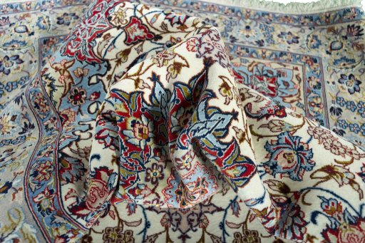 Backside of handmade 2000s Isfahan rug showing knot structure and weave density