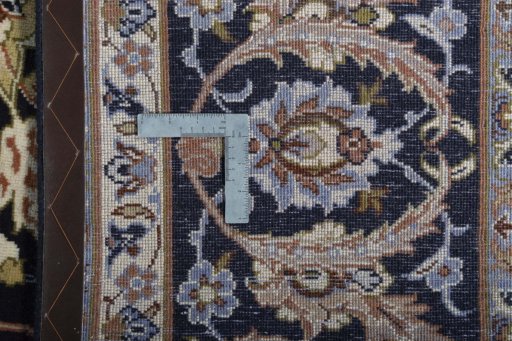 Backside of handmade 2000s Isfahan rug showing knot structure and weave density