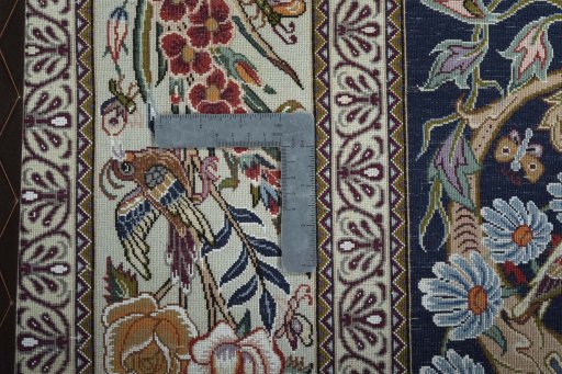Backside of handmade New Isfahan rug showing knot structure and weave density