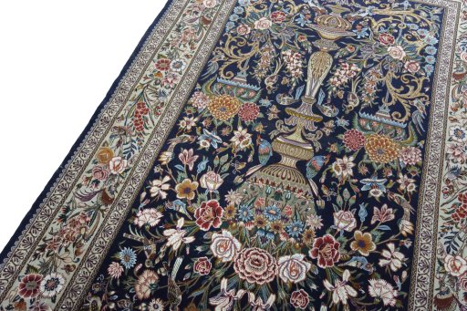 Backside of handmade New Isfahan rug showing knot structure and weave density