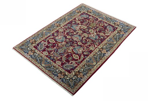 Corner detail of 2000s Isfahan rug showing border pattern and Cork pile