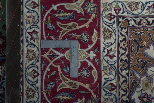 Backside of handmade New Isfahan rug showing knot structure and weave density