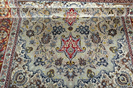 Surface texture of 2000s Isfahan rug with natural Cork and intricate pattern