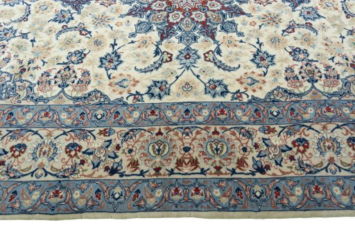 Corner detail of 2000s Isfahan rug showing border pattern and Cork pile