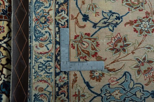 Backside of handmade 1970s Isfahan rug showing knot structure and weave density