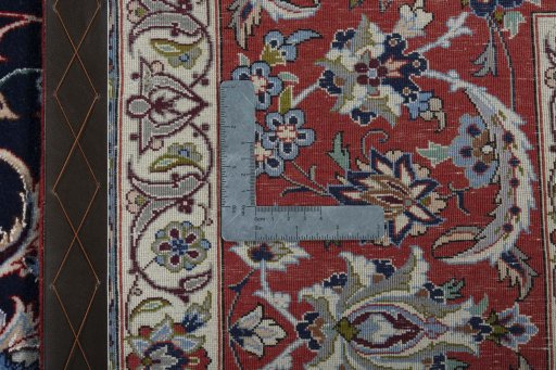 Backside of handmade New Isfahan rug showing knot structure and weave density