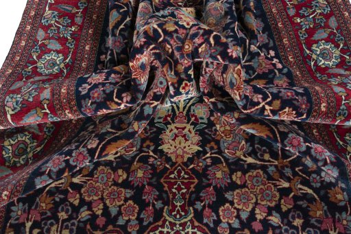 Surface texture of 1930s Isfahan rug with natural Wool and intricate pattern