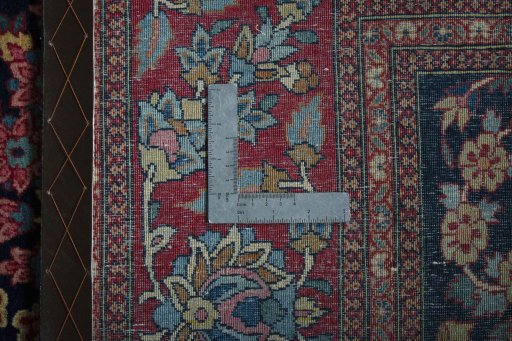 Backside of handmade 1930s Isfahan rug showing knot structure and weave density