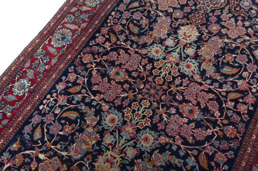 Backside of handmade 1930s Isfahan rug showing knot structure and weave density