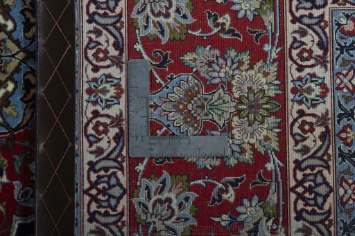 Backside of handmade New Isfahan rug showing knot structure and weave density