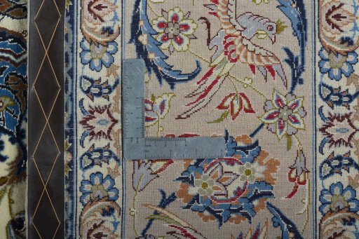Backside of handmade 2000s Isfahan rug showing knot structure and weave density