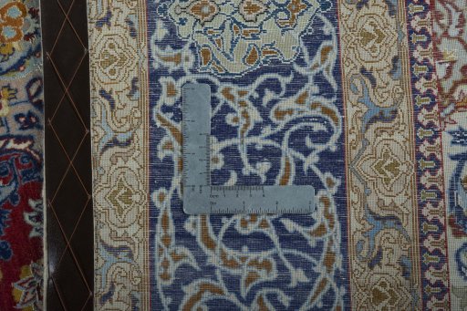 Backside of handmade 1970s Isfahan rug showing knot structure and weave density