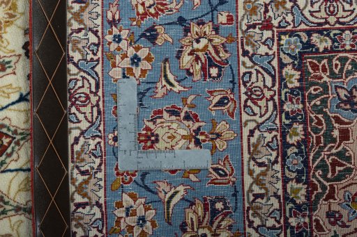 Backside of handmade 1950s Isfahan rug showing knot structure and weave density