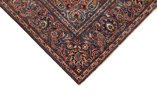 Backside of handmade 1920s Kashan rug showing knot structure and weave density