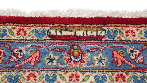 Close-up detail of New Kashan rug from Iran / Persia showing Wool weave