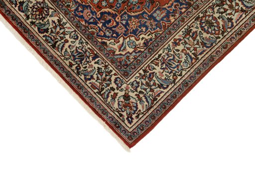 Backside of handmade 1940s Kashan rug showing knot structure and weave density
