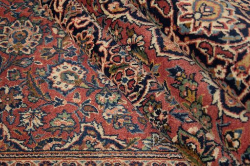 Corner detail of New Kashan rug showing border pattern and Wool pile