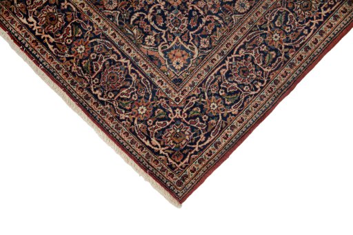 Backside of handmade New Kashan rug showing knot structure and weave density
