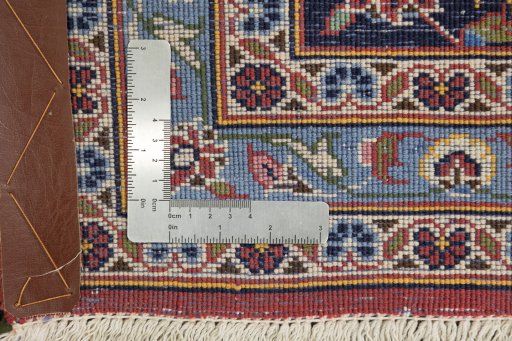 Corner detail of 1990s Kashan rug showing border pattern and Cork pile