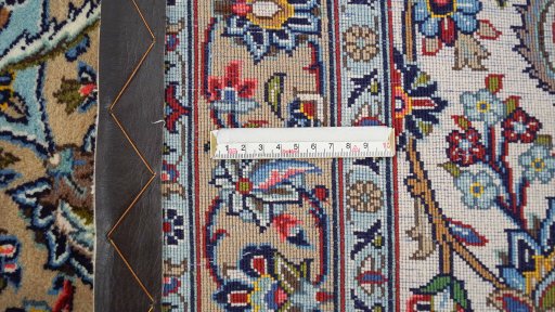 Corner detail of 1980s Kashan rug showing border pattern and Wool pile