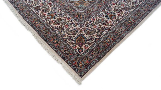 Backside of handmade 1980s Kashan rug showing knot structure and weave density