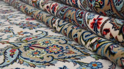 Full view of 1980s Kashan rug from Iran / Persia, 489 × 342 cm in Cream tones