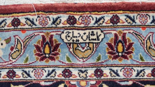 Close-up detail of 1980s Kashan rug from Iran / Persia showing Wool weave