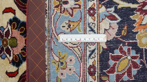Backside of handmade 1980s Kashan rug showing knot structure and weave density