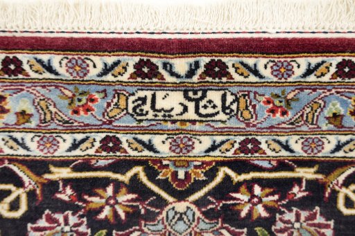 Backside of handmade 1980s Kashan rug showing knot structure and weave density