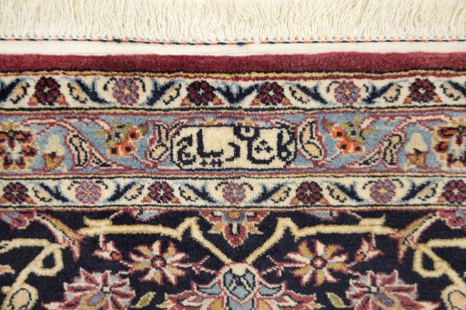 Backside of handmade 1980s Kashan rug showing knot structure and weave density