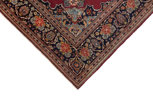 Backside of handmade 1940s Kashan rug showing knot structure and weave density