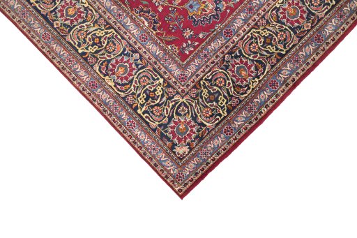 Backside of handmade 1950s Kashan rug showing knot structure and weave density