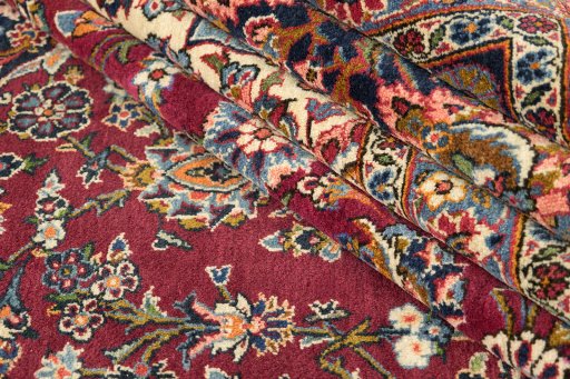 Corner detail of 1950s Kashan rug showing border pattern and Wool pile