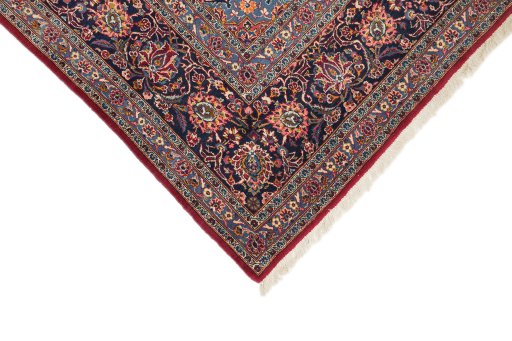 Backside of handmade 1950s Kashan rug showing knot structure and weave density