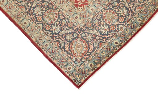 Backside of handmade 1950s Kashan rug showing knot structure and weave density