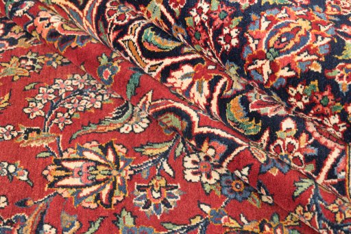 Corner detail of 1950s Kashan rug showing border pattern and Wool pile